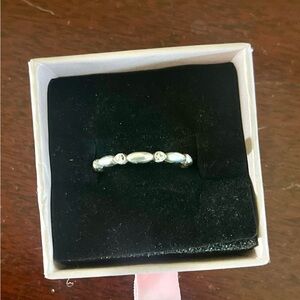 Brighton Elegant Silver Band with Gem Accents can be used as a stacking ring